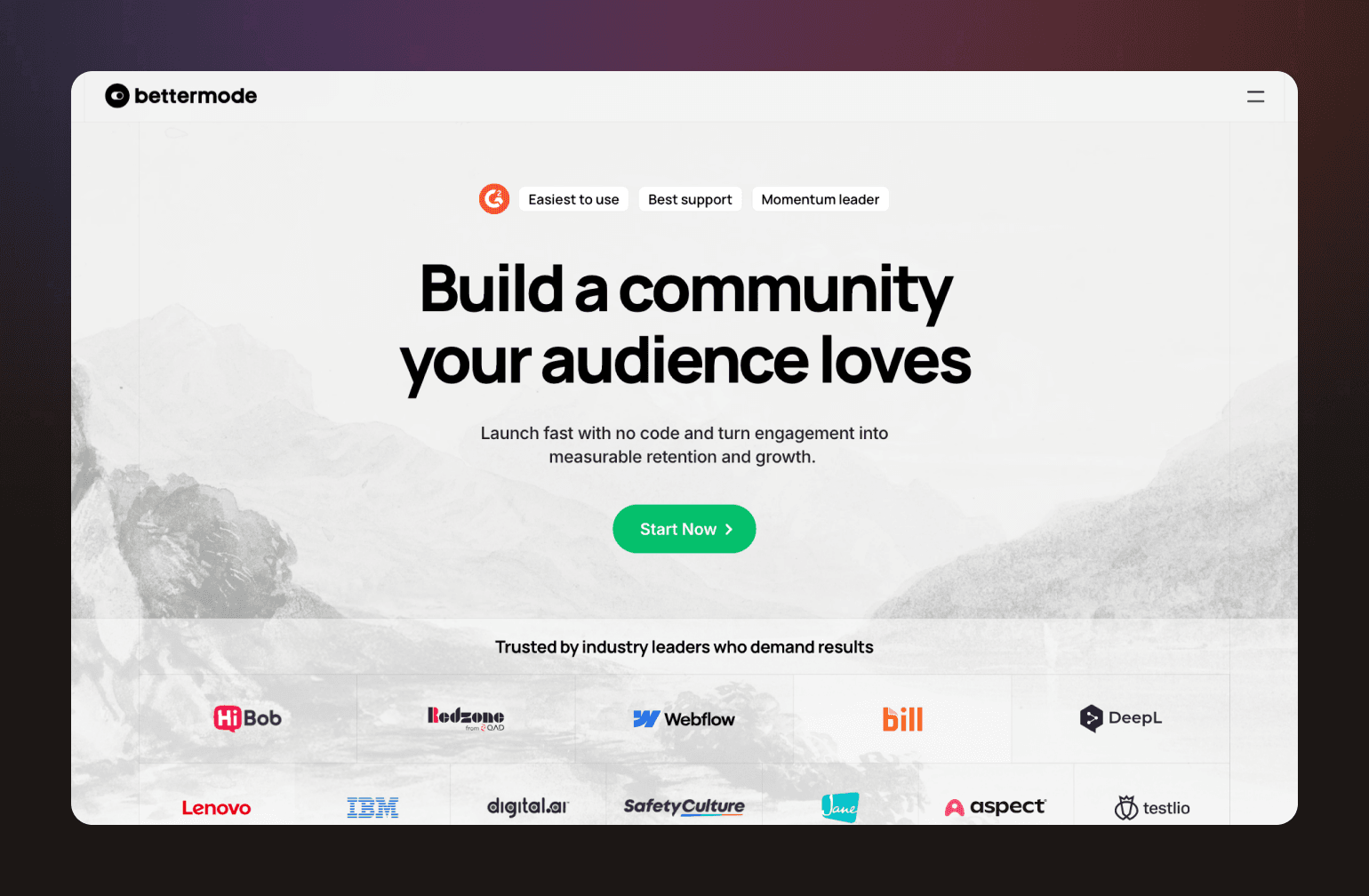 Bettermode community platform homepage featuring headline "Build a community your audience loves" with mountain landscape background and partner logos including IBM, Webflow, Lenovo, and others